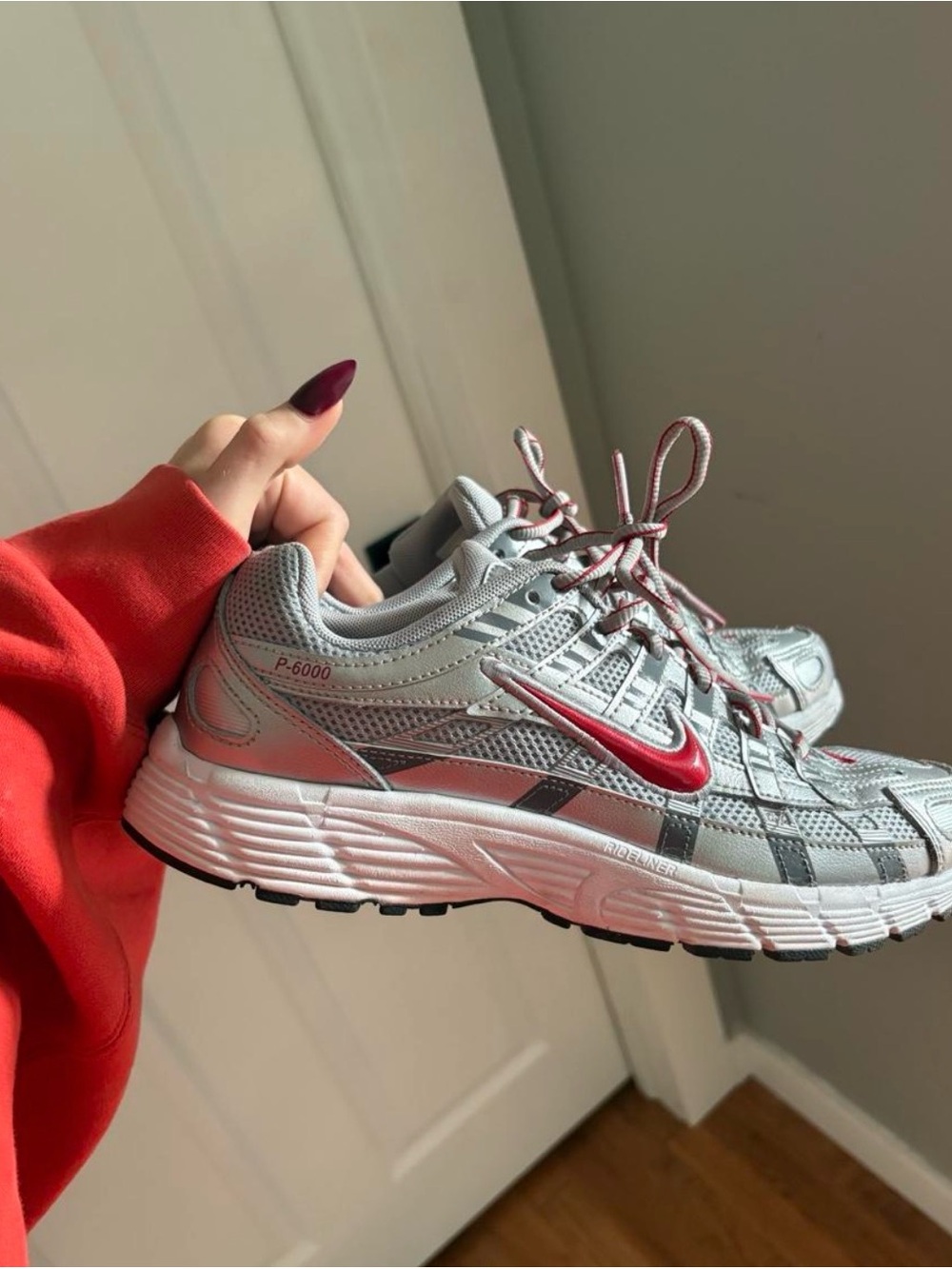 Nike Women’s Silver and Red Swoosh Sneakers